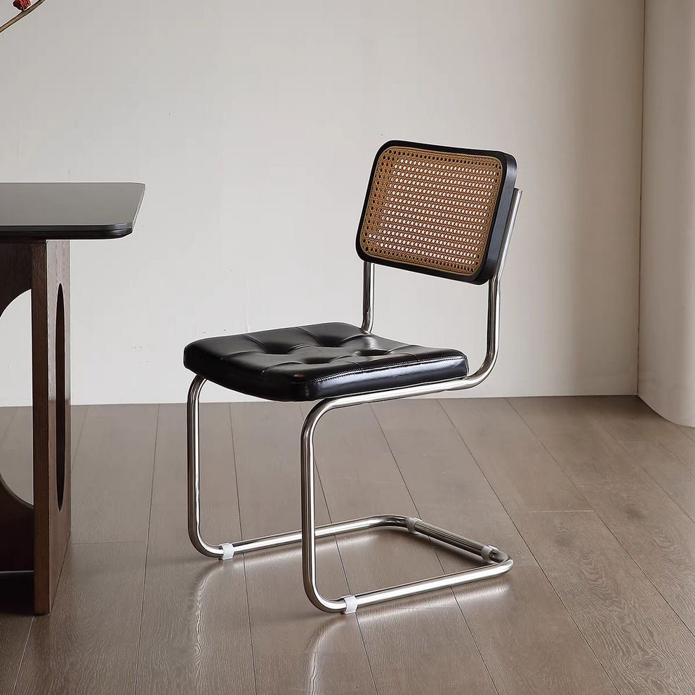 Rattan & Chrome — The Cantilever Dining Chair